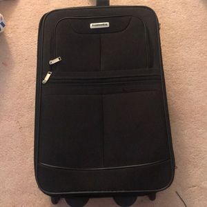A black small carry-on suitcase